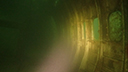 The interior of a sunken 727, in low light.
